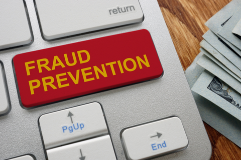 Keys on Laptop Keyboard with Fraud Prevention Written